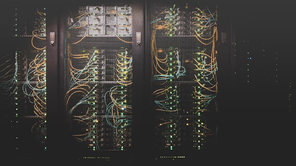 Modern data centre server racks with blue indicator lighting